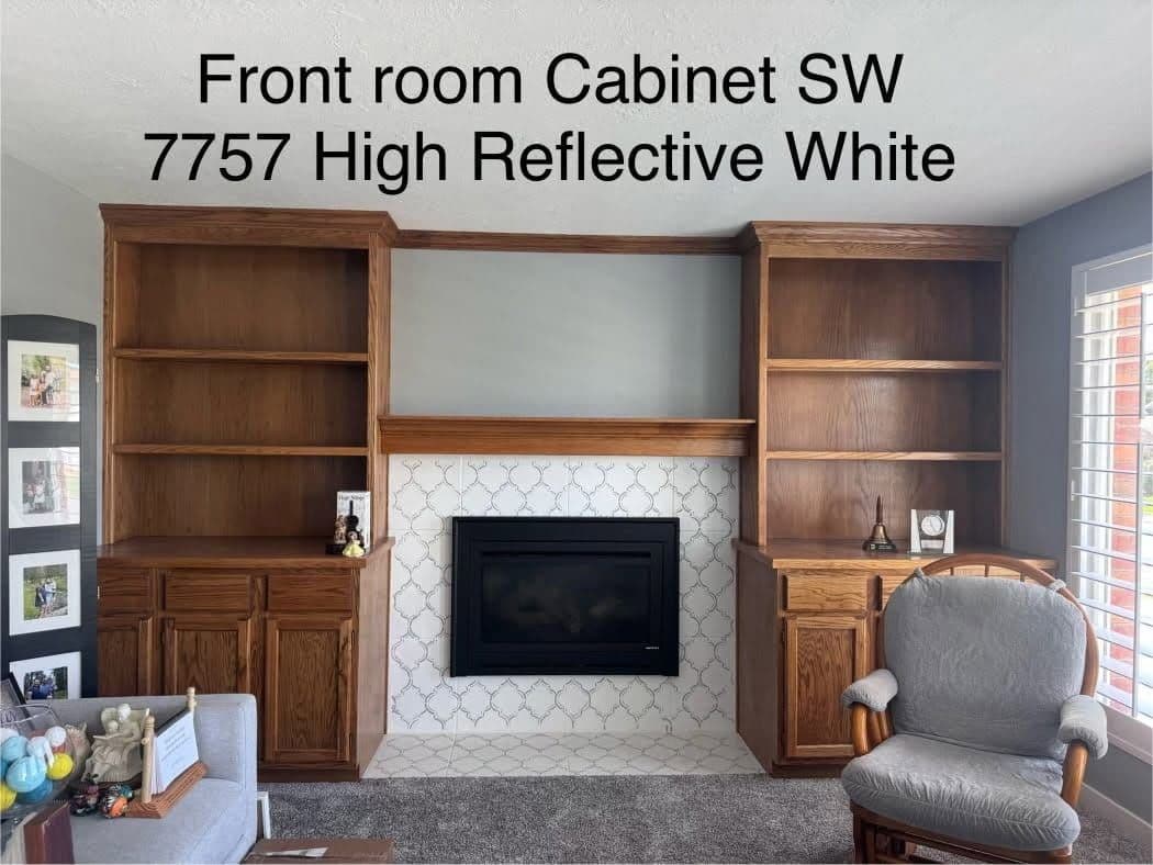 Front-room oak built-in shelving and mantel prepped for refinishing in Sherwin-Williams High Reflective White.